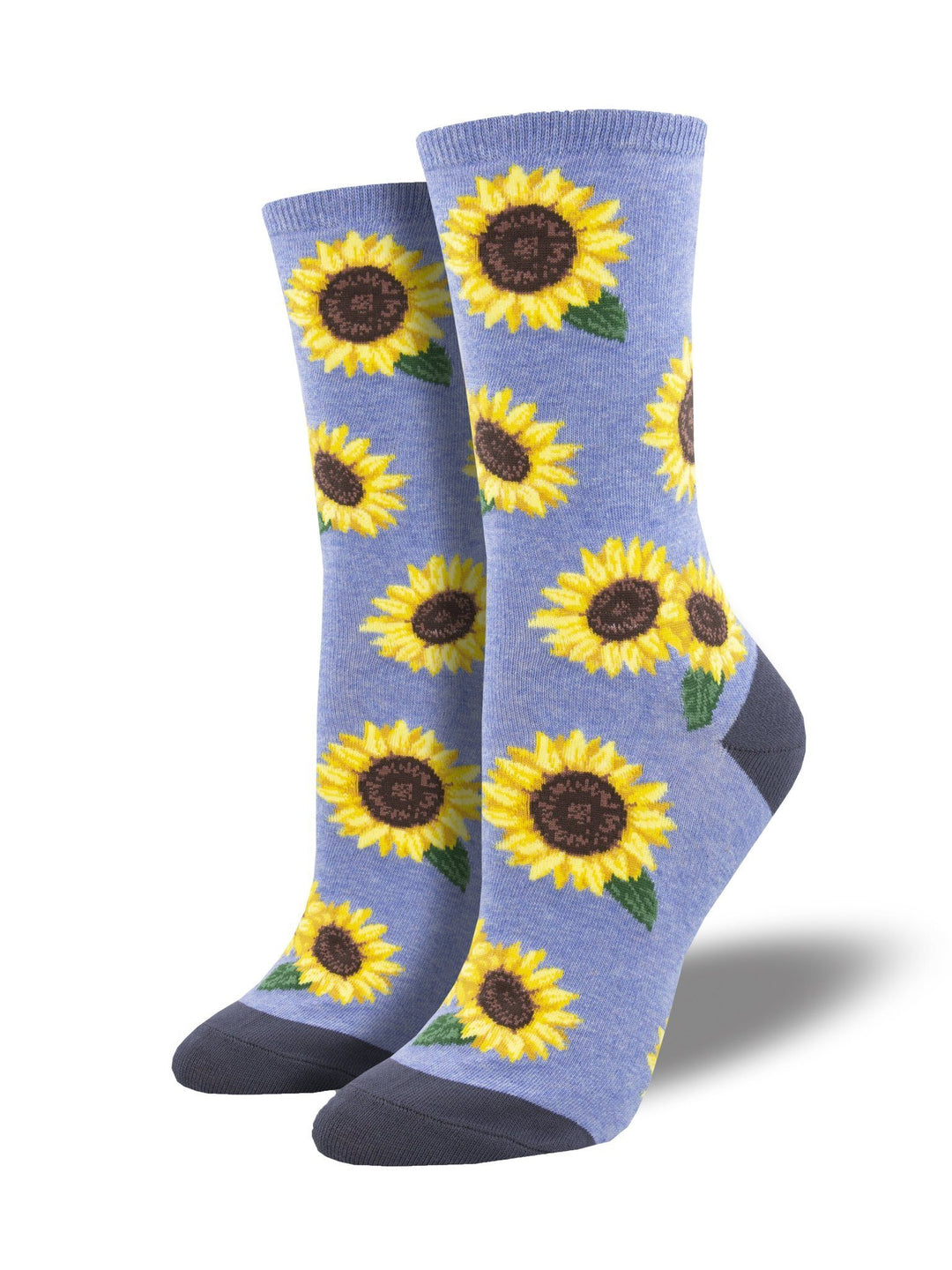 Women's sunflower crew socks shown as a pair on periwinkle blue with yellow sunflowers and charcoal heels and toes