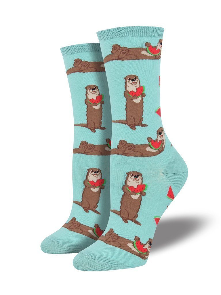 Pair of women's mint-green crew socks displayed upright, patterned with brown otters holding red watermelon slices