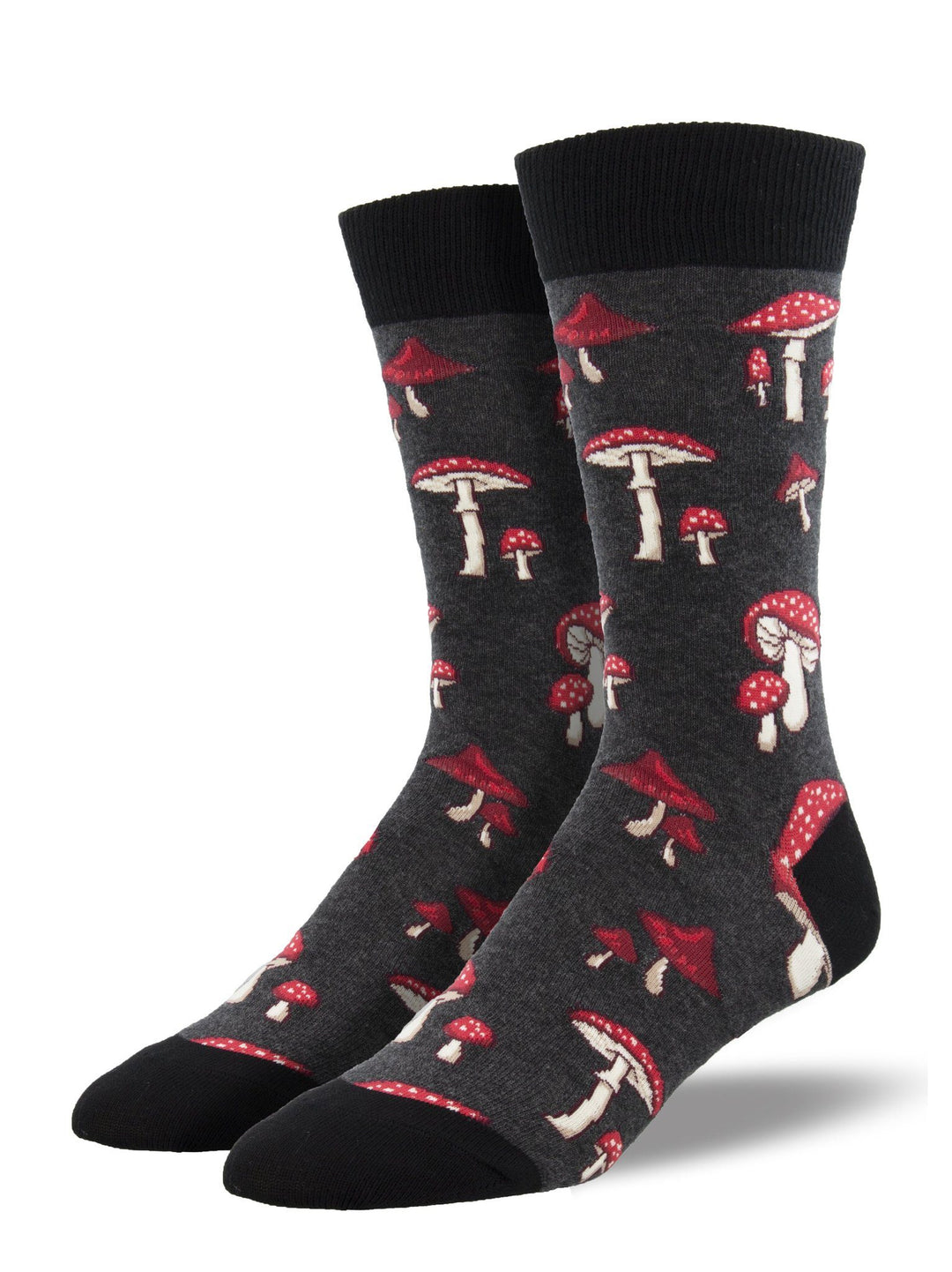 Men's mushroom crew socks on foot forms, charcoal gray with red white-spotted toadstools and black cuff and toe