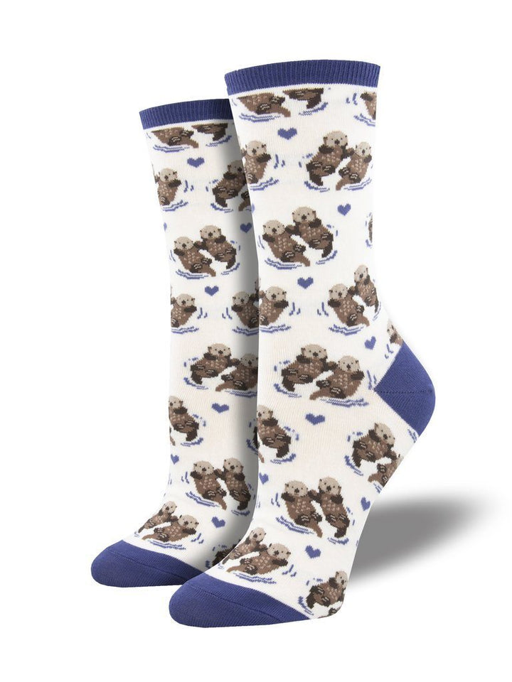 Pair of cream sea otter crew socks with blue cuff, heel and toe