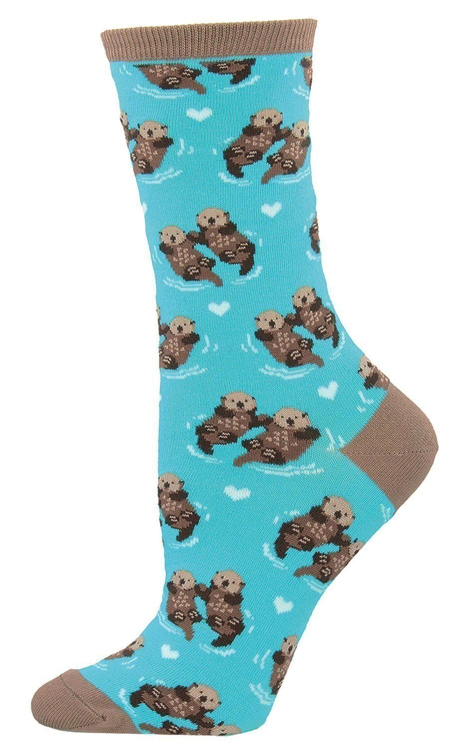 Light blue women's crew sock with sea otters holding hands and small hearts, tan heel and toe