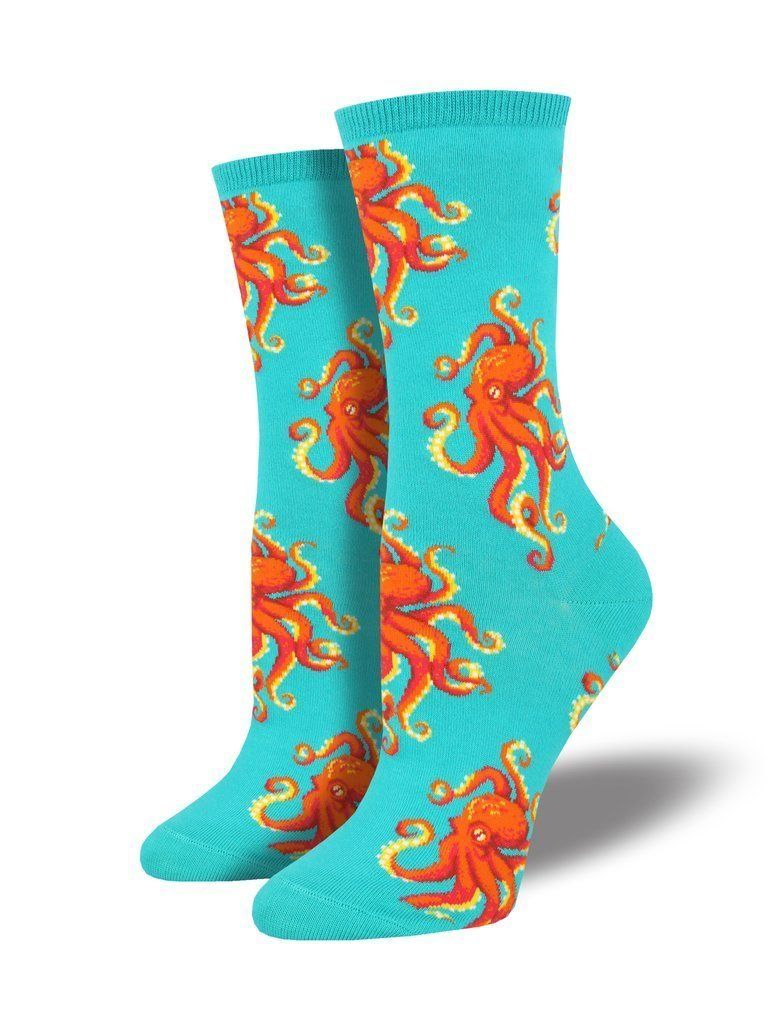 Pair of women's turquoise crew socks displayed upright, covered with bright red-and-orange octopuses and curling tentacles