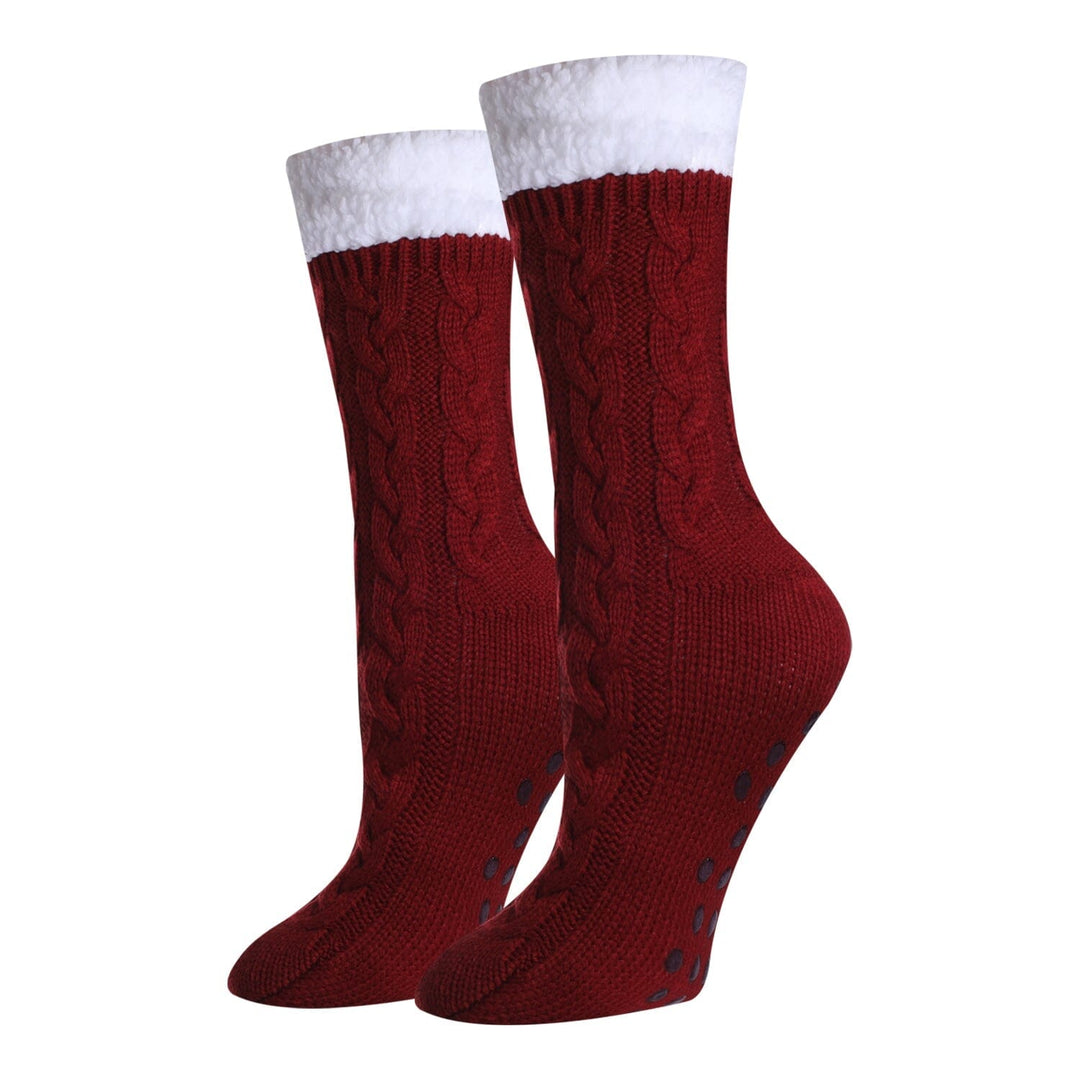 Women's solid red sherpa-lined cable-knit crew socks, flat front view with white fluffy cuff and gripped sole