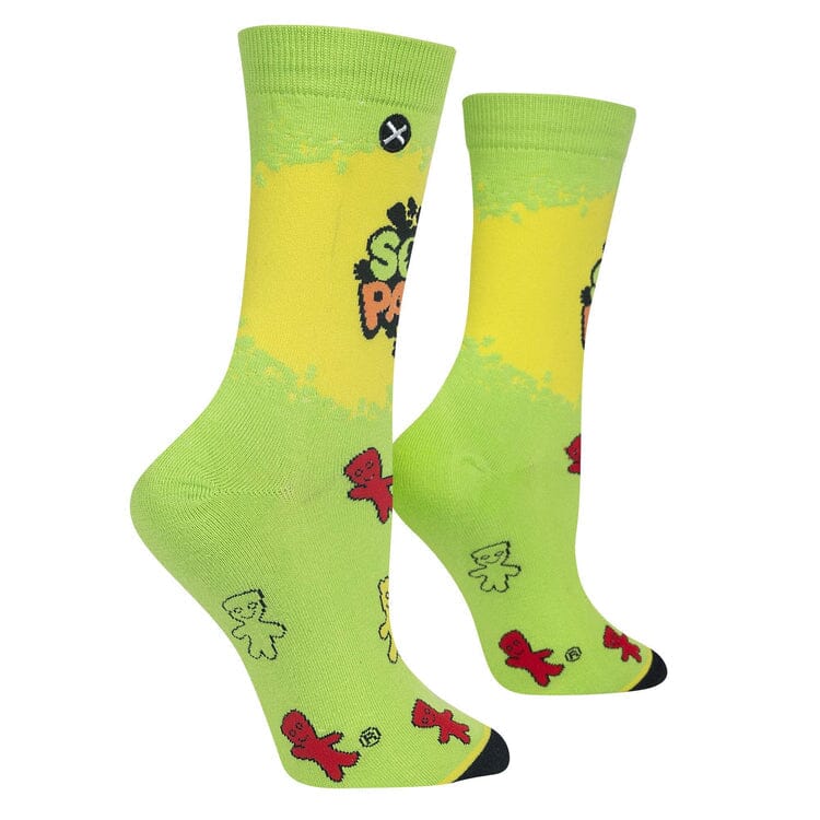 Side angle of the green Sour Patch Kids socks revealing more candy characters down the foot