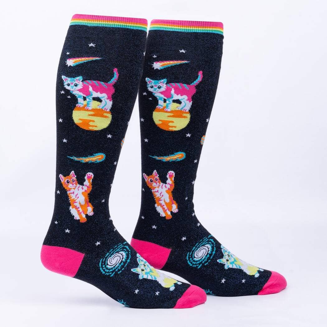 Black glittery women's knee high socks with rainbow space cats on planets, rainbow cuff and pink toe, front view