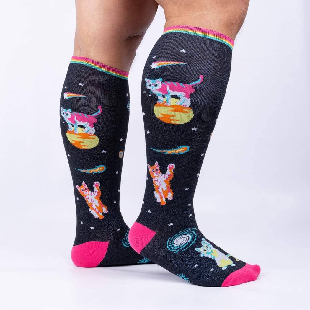 Side view of the space cat knee highs worn on legs, showing kitties, comets and galaxies