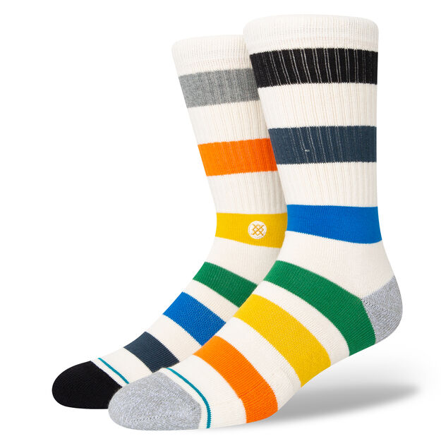 Pair of cream women's Amistad crew socks displayed upright, with bold multicolor rugby stripes and grey and black toes