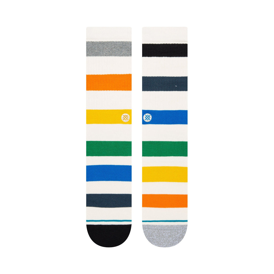 Flat-laid pair of the striped Amistad crew socks showing the front and back with multicolor bands and contrast toes