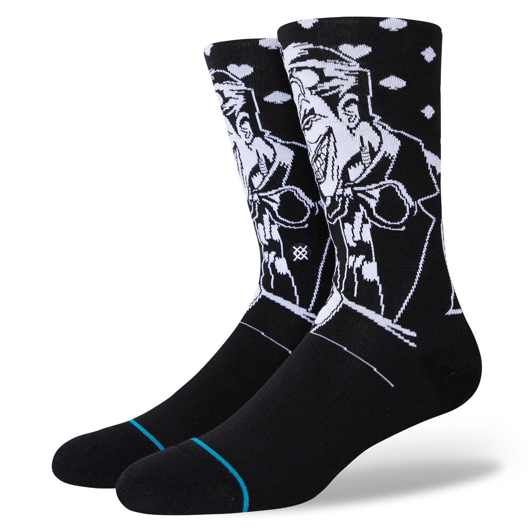 Pair of men's black Joker crew socks shown flat, with white line art of the laughing DC villain and a teal toe stripe