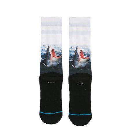 Bottom view of the shark socks with black cushioned soles and blue accent stripe