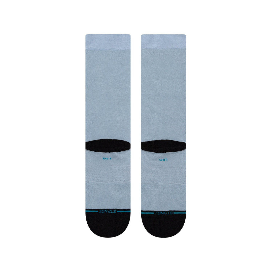 Back view of the slate blue Ahsoka socks showing plain leg, black toe, and Stance branding on the sole