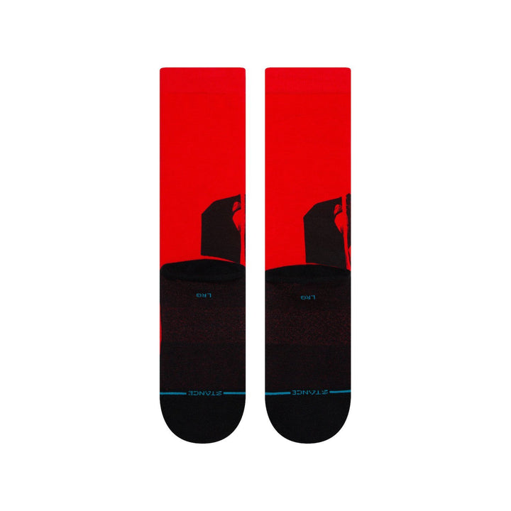 Back view of red Mando socks showing the silhouette detail and Stance branding on the black sole