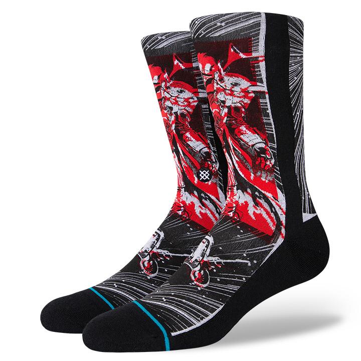 Pair of men's Star Wars Manga Mando crew socks shown flat at an angle, with a manga-style Mandalorian bounty hunter in black, grey and red over a starfield