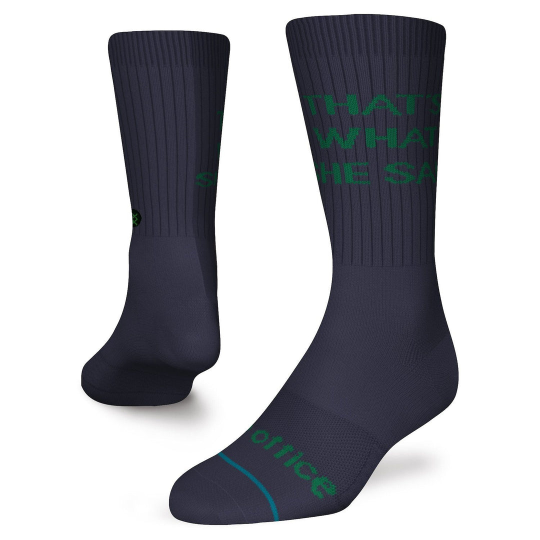 Men's navy The Office crew socks worn on a foot form with green "That's What She Said" lettering up the leg