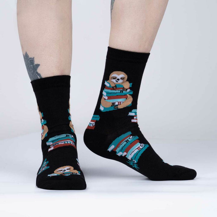 Person wearing the sloth and books crew socks, side view