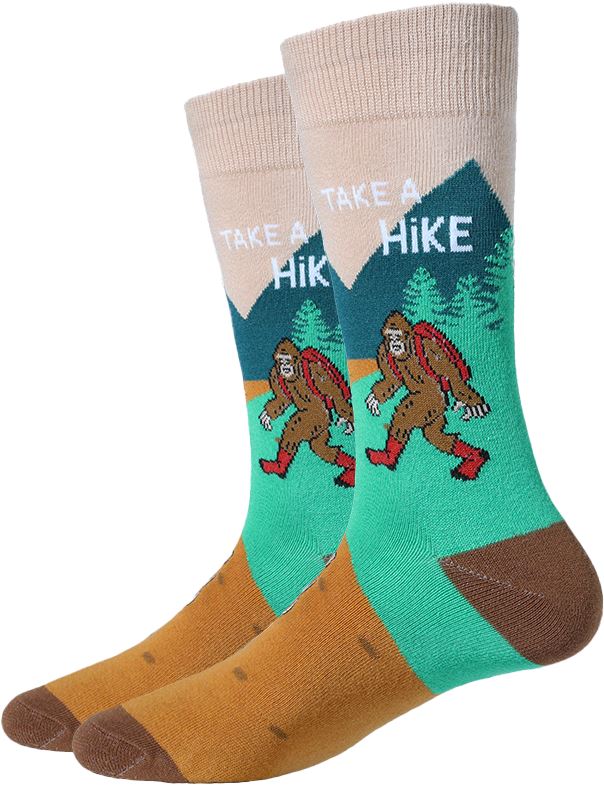 Men's Take A Hike Bigfoot crew socks, flat front view with hiking Sasquatch, pines and Take A Hike text