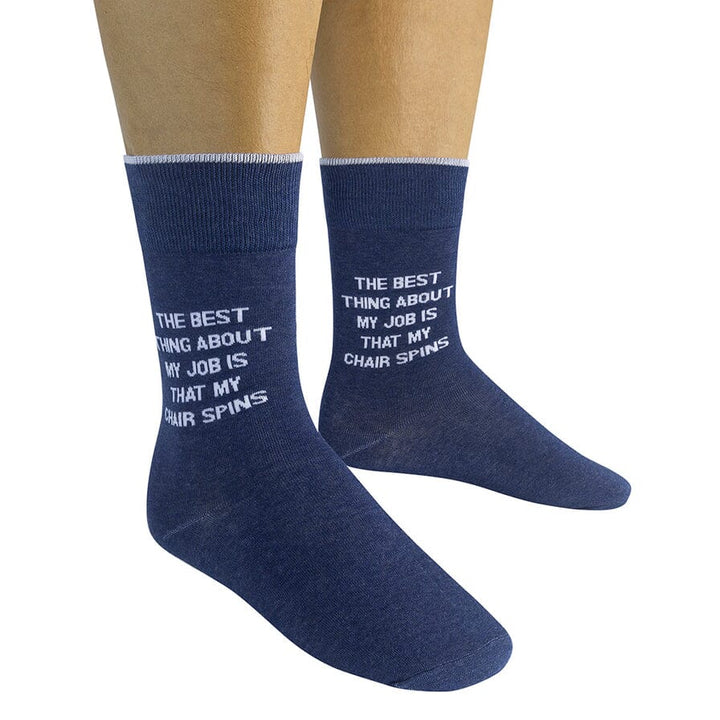 Two denim-blue office saying socks worn on a model showing the full quote