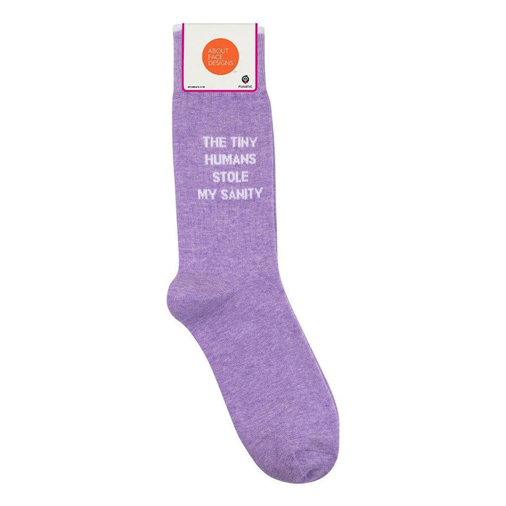 Heather-purple "Tiny Humans Stole My Sanity" crew sock in its About Face Designs packaging