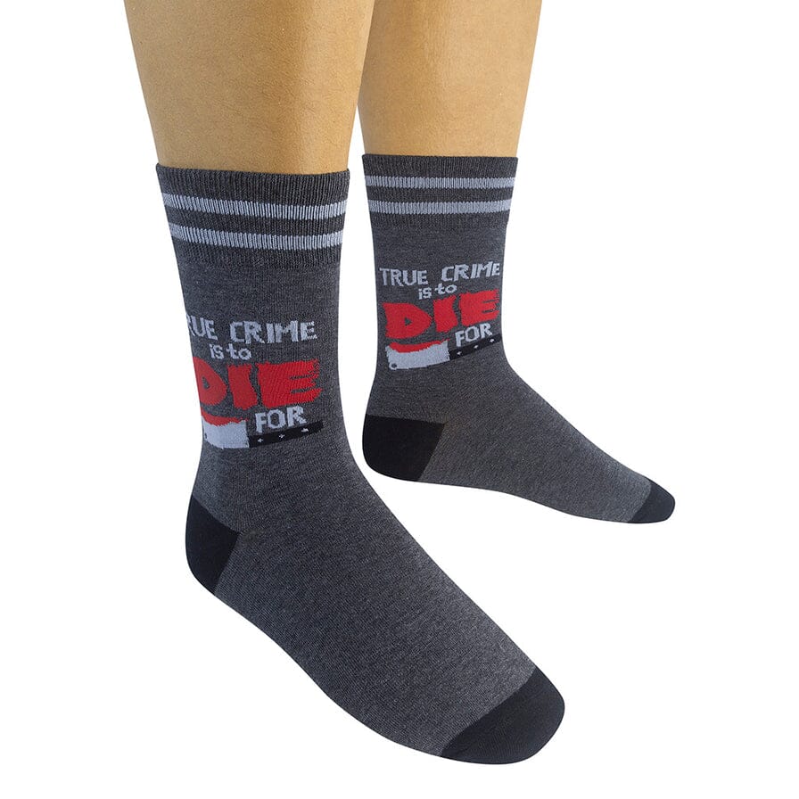 Pair of charcoal true crime socks worn on a model's legs showing front and side views
