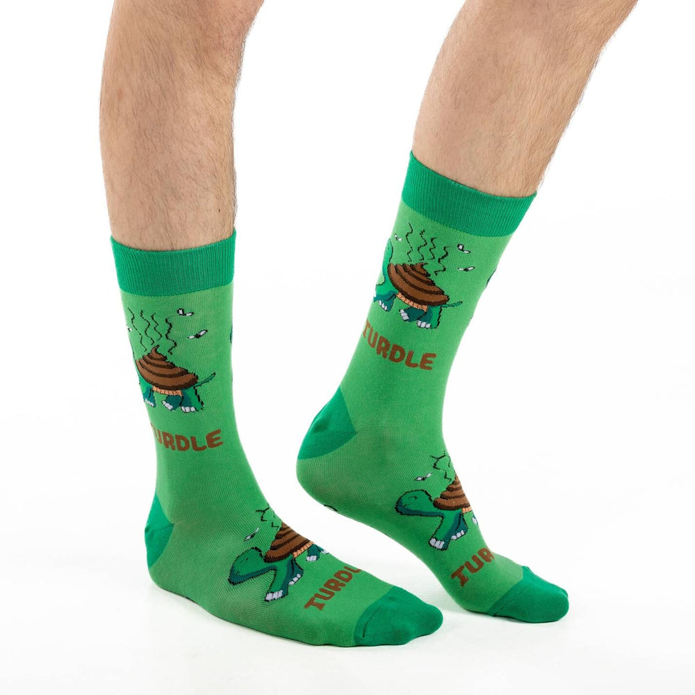 Men's Turdle crew socks worn on a model showing the cartoon turtle pattern