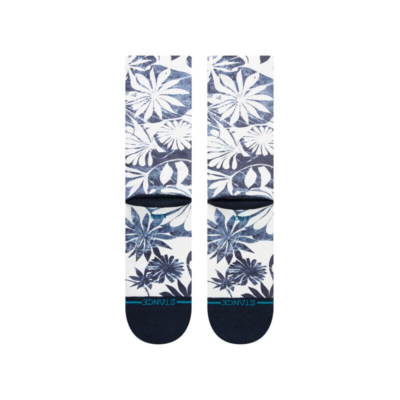 Front-leg detail of the Waikaloa socks with faded indigo flowers and the Stance logo at the cuff