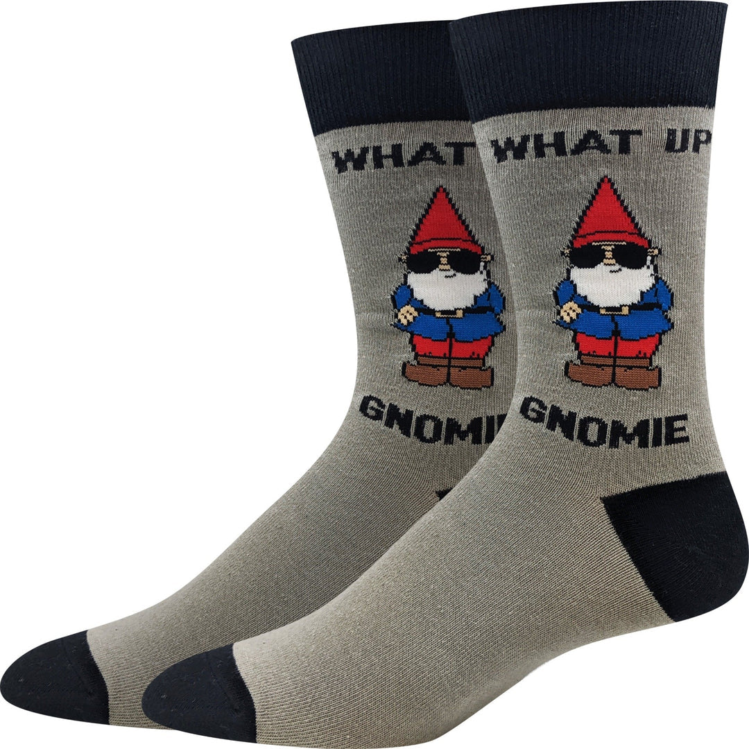 Pair of heathered gray men's crew socks with navy cuff, heel, and toe reading WHAT UP GNOMIE above a sunglasses-wearing garden gnome in a blue jacket