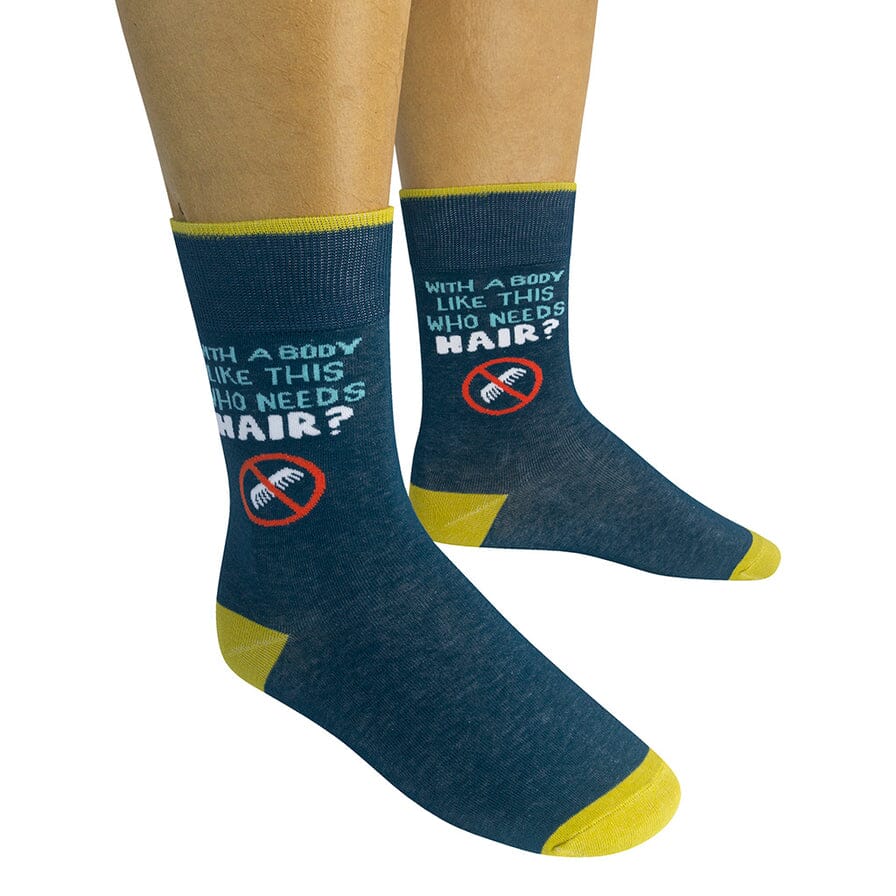 Two navy bald-humor socks worn on a model showing the saying and no-comb symbol