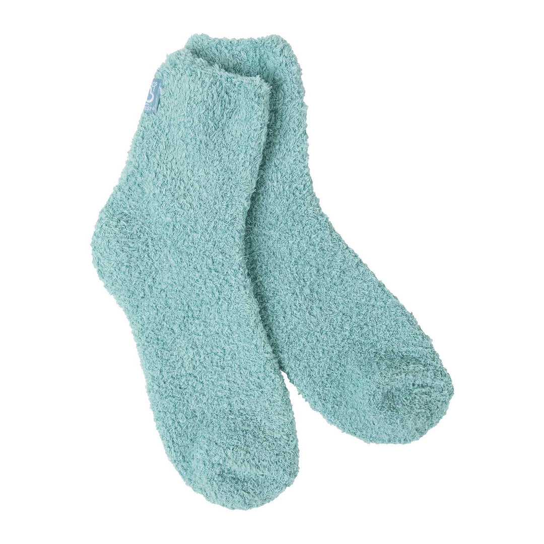 Pair of fuzzy seafoam green quarter ankle socks shown on a white background