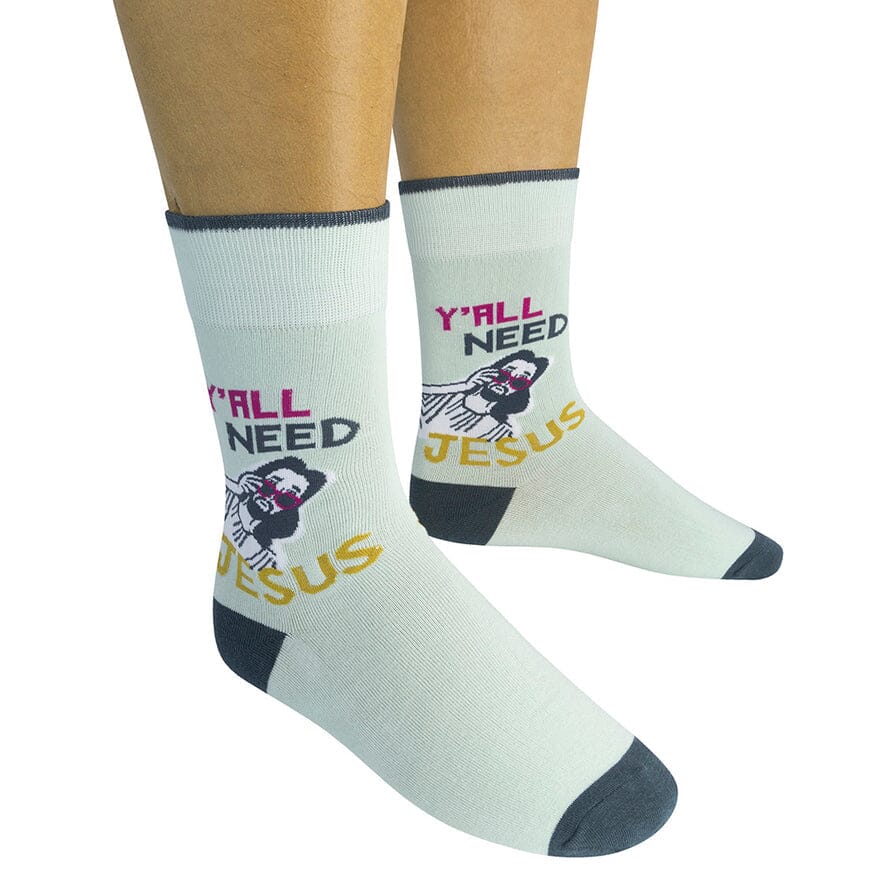 Two mint 'Y'All Need Jesus' socks worn on a model showing the sunglasses Jesus design